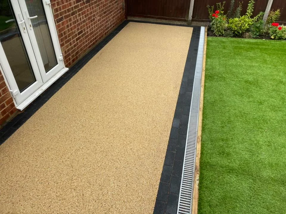 Resin bound patio with garden drainage channel